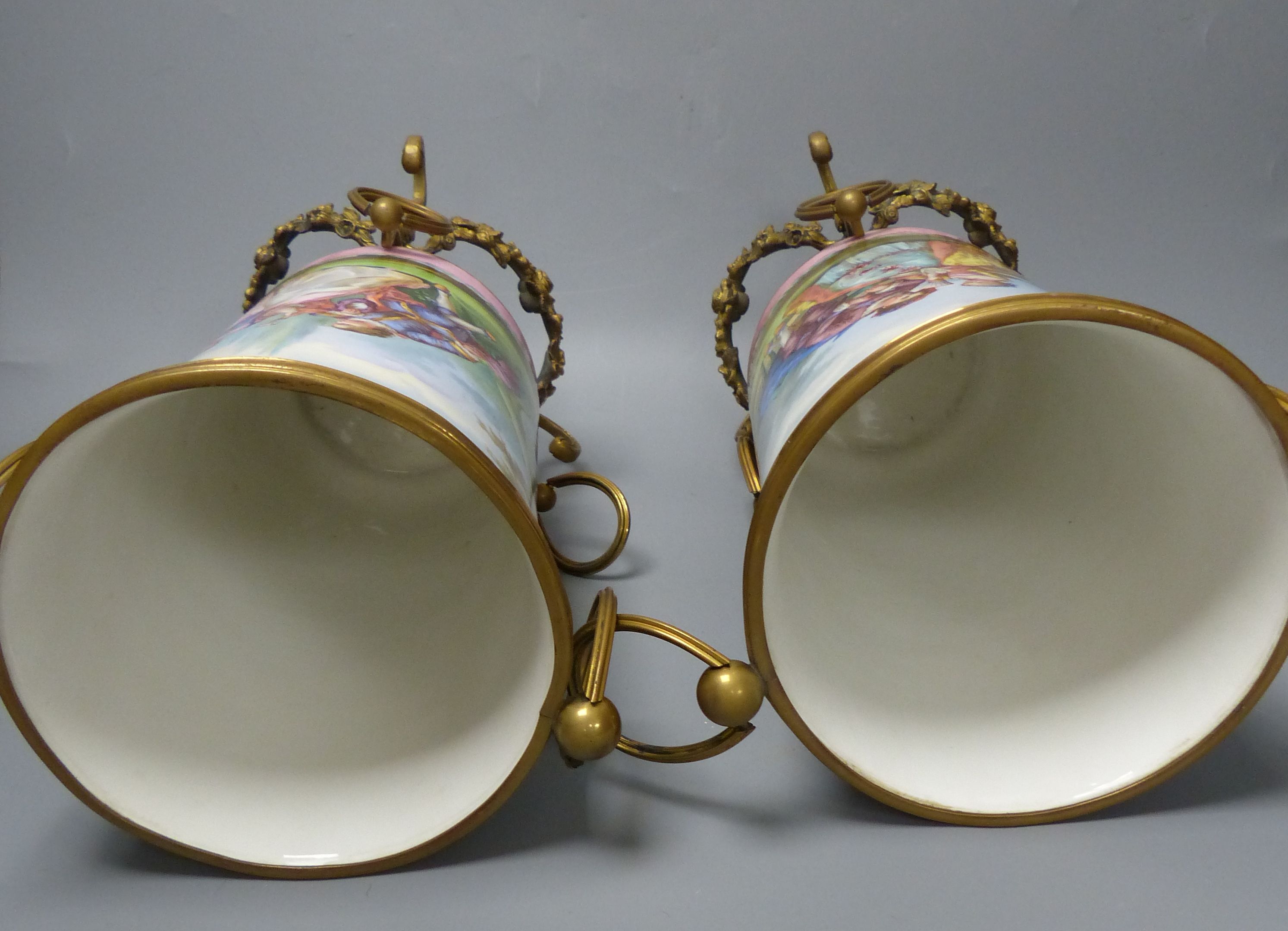 A pair of late 19th century Paris porcelain and gilt metal mounted vases, height 33cm